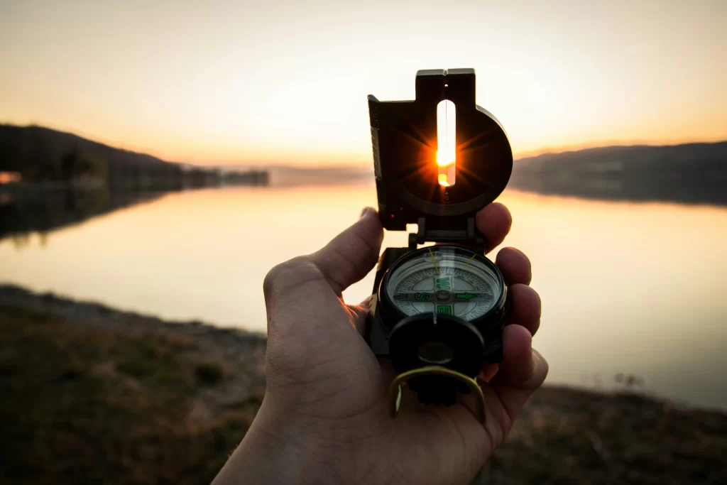 man using a compass to navigate Illinois process service law